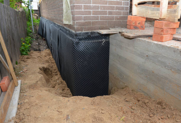 SJ Waterproofing Pros technician performing targeted Emergency Waterproofing assessment in Derby, KS